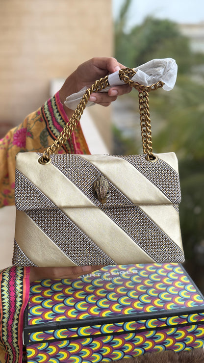 Kurt Geiger London Kensington bag featuring a gold satin and crystal-embellished design.Master Series-With box