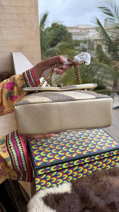 Kurt Geiger London Kensington bag featuring a gold satin and crystal-embellished design.Master Series-With box