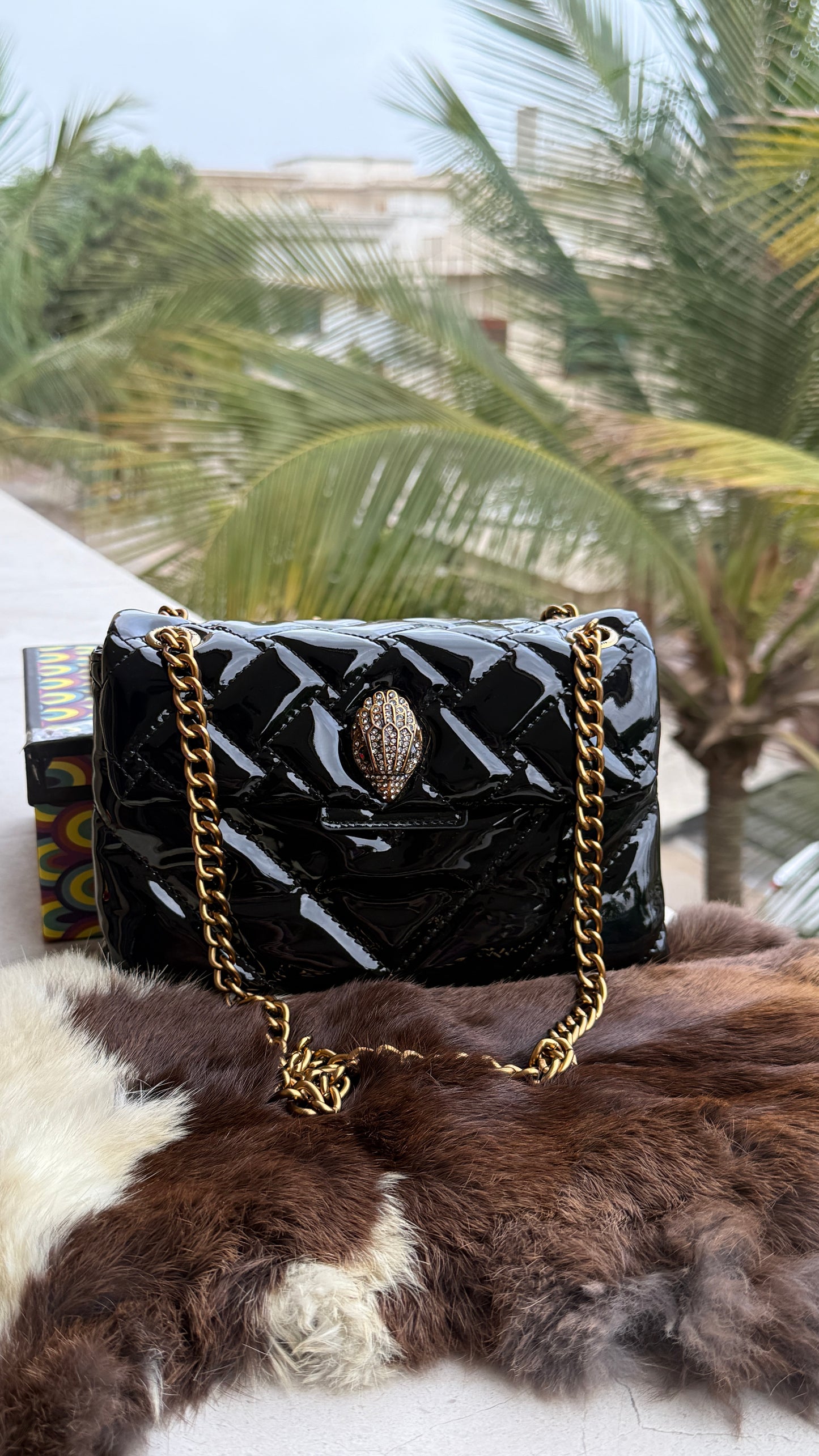 Kurt Geiger Kensington shoulder bag featuring quilted black patent leather and a signature eagle head embellished with crystals-Master Series With Box