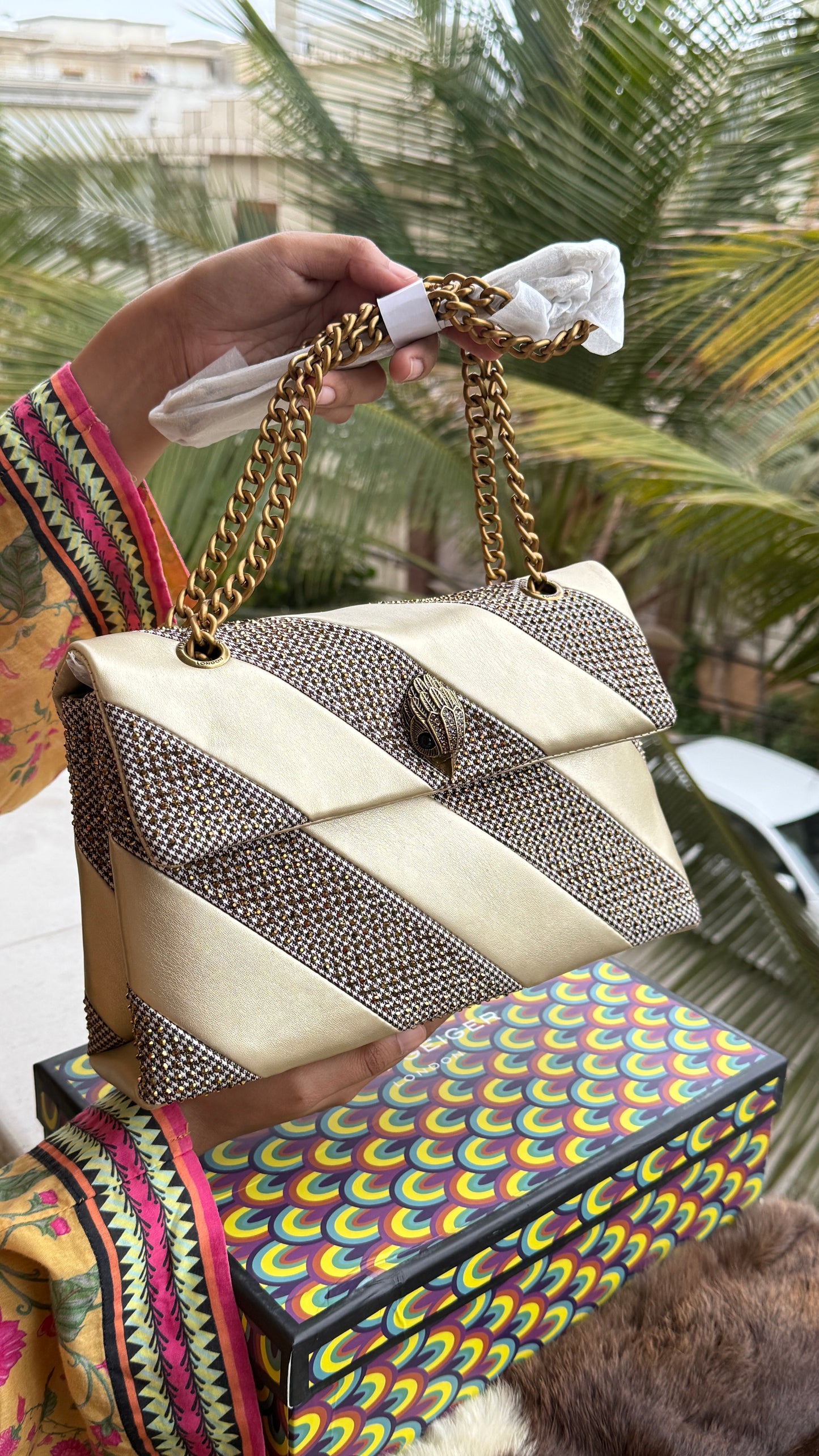 Kurt Geiger London Kensington bag featuring a gold satin and crystal-embellished design.Master Series-With box