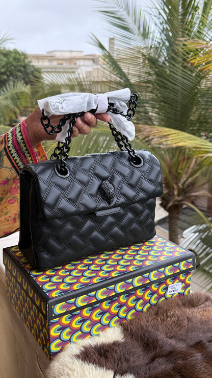 Kurt Geiger Kensington Drench Shoulder Bag, featuring a distinct all-black quilted leather design and a black eagle head charm.Master Series-Box included