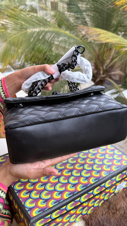 Kurt Geiger Kensington Drench Shoulder Bag, featuring a distinct all-black quilted leather design and a black eagle head charm.Master Series-Box included