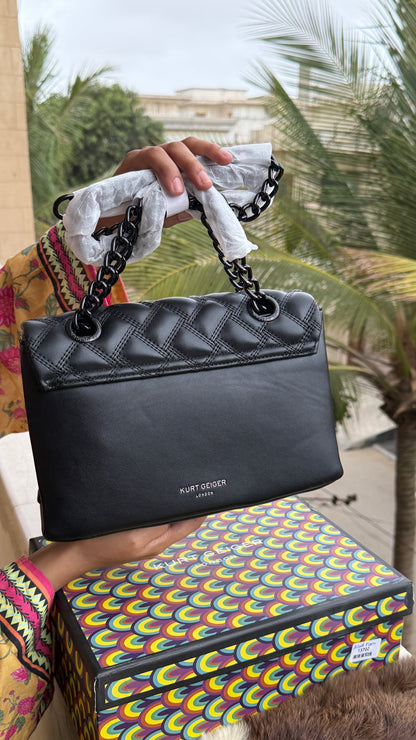 Kurt Geiger Kensington Drench Shoulder Bag, featuring a distinct all-black quilted leather design and a black eagle head charm.Master Series-Box included