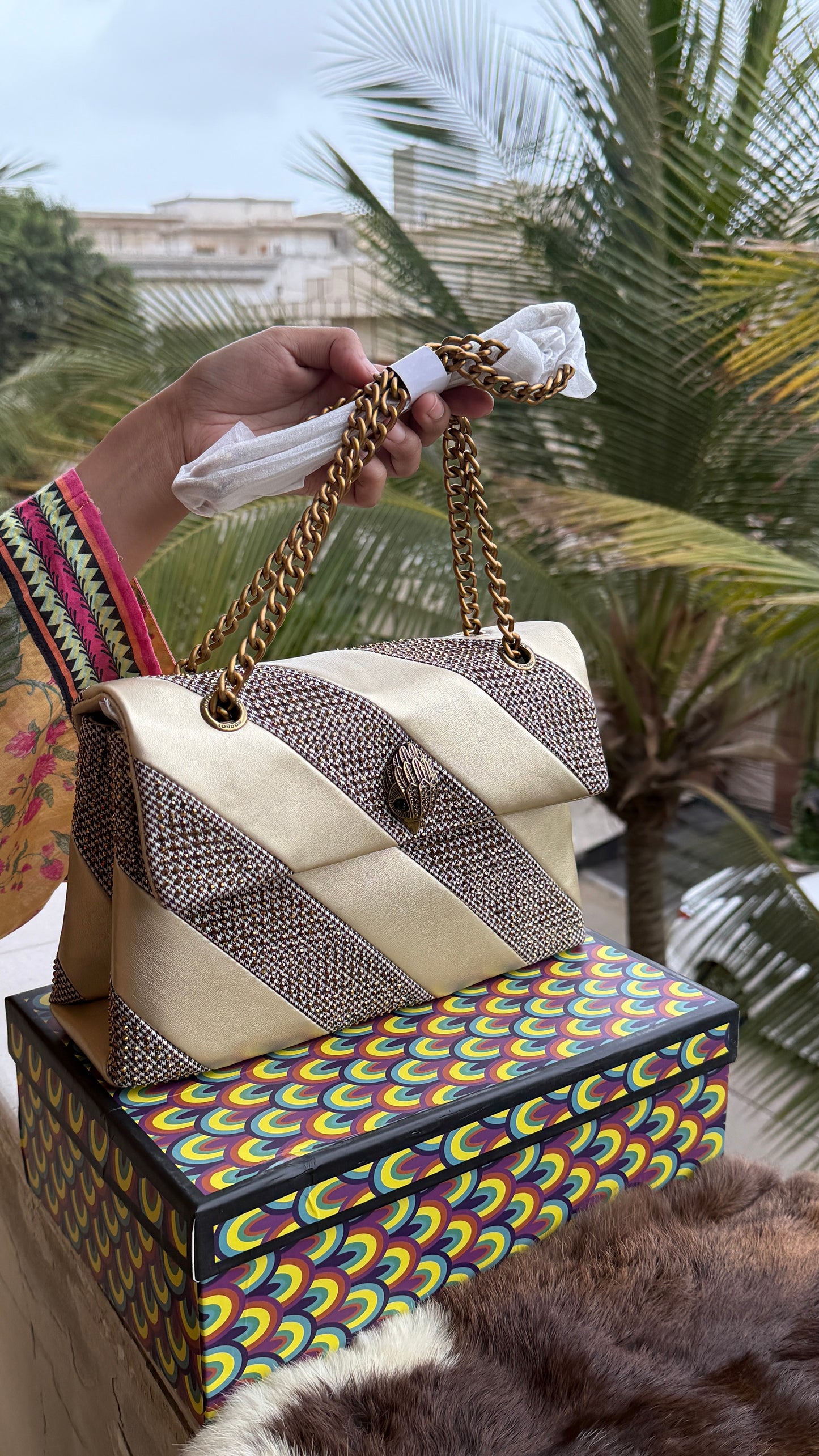 Kurt Geiger London Kensington bag featuring a gold satin and crystal-embellished design.Master Series-With box