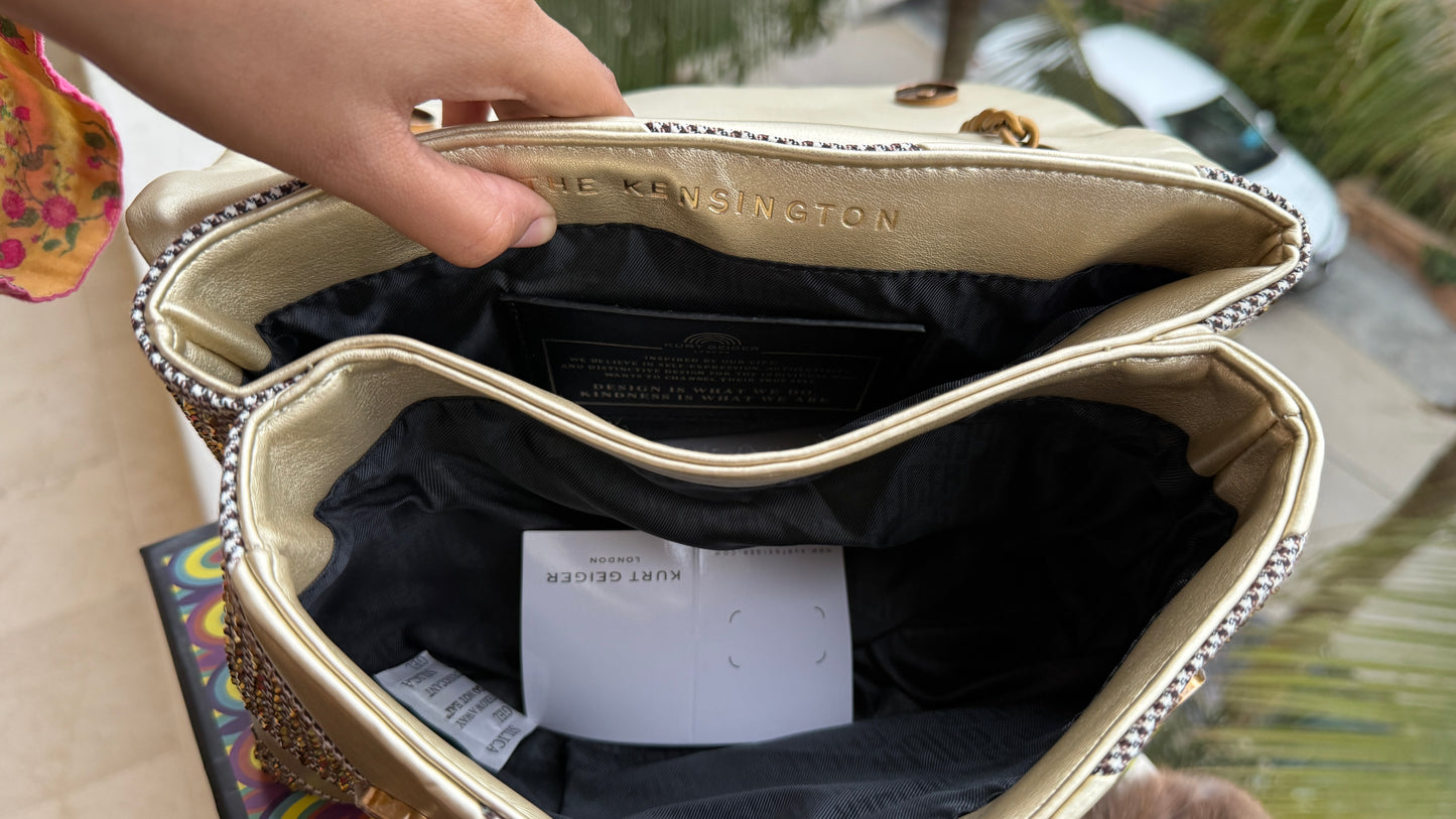 Kurt Geiger London Kensington bag featuring a gold satin and crystal-embellished design.Master Series-With box