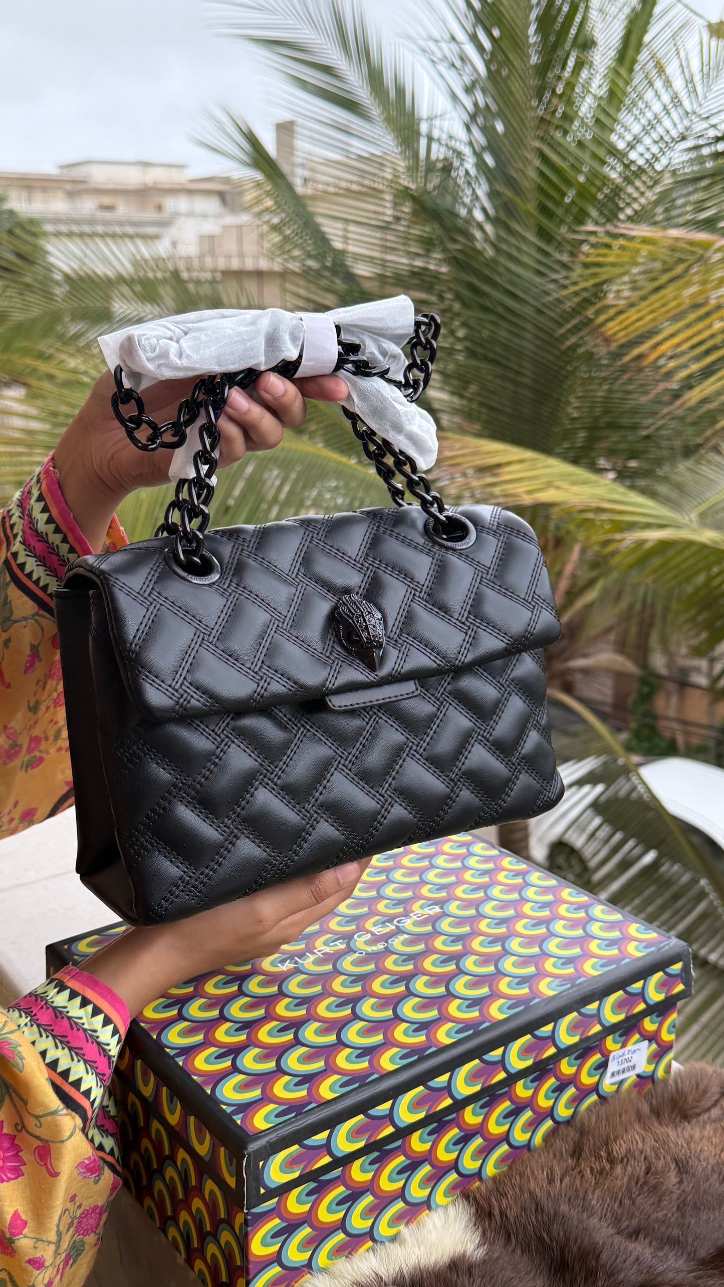 Kurt Geiger Kensington Drench Shoulder Bag, featuring a distinct all-black quilted leather design and a black eagle head charm.Master Series-Box included