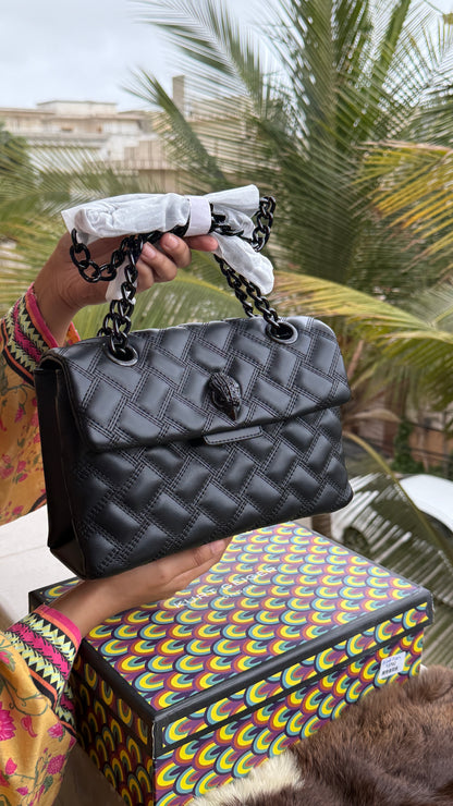 Kurt Geiger Kensington Drench Shoulder Bag, featuring a distinct all-black quilted leather design and a black eagle head charm.Master Series-Box included