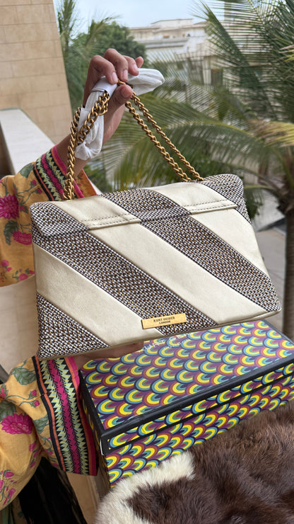 Kurt Geiger London Kensington bag featuring a gold satin and crystal-embellished design.Master Series-With box